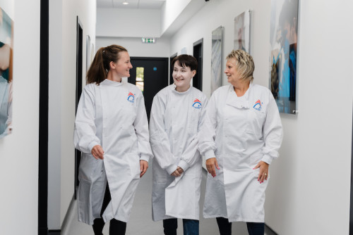 Three team members at the Global Centre for Genomics